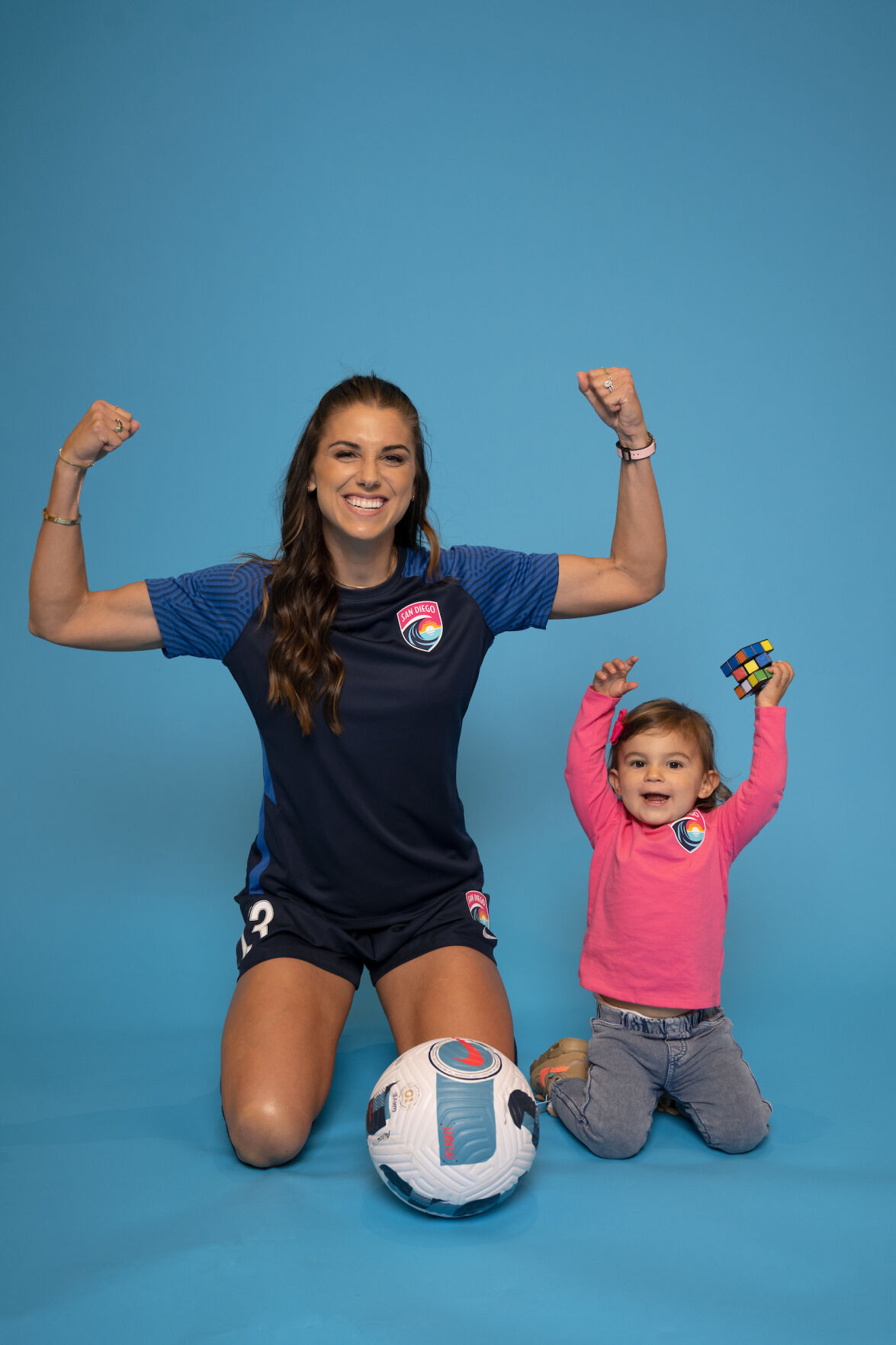 Alex Morgan and daughter - strong