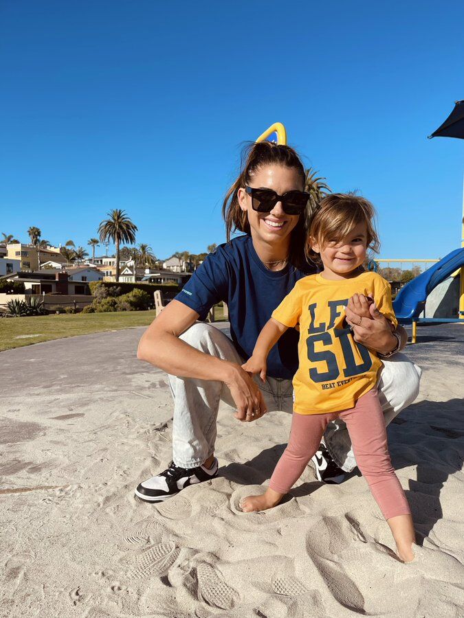 Alex Morgan and daughter at beach